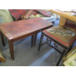 An early 20th century tapestry topped stool, together with a nest of three tables