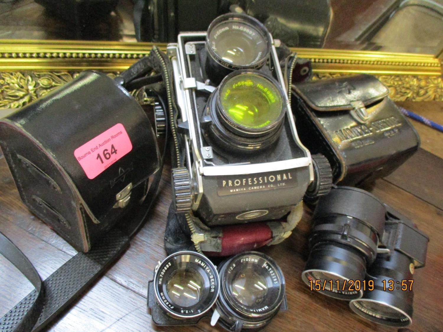 A Mamiya C220 Professional twin reflex camera and accessories