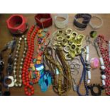 1960s and later fashion jewellery, mostly beaded, together with chunky retro bangles and a pair of