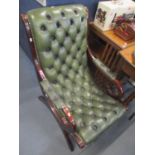 A reproduction green leather button back slipper chair