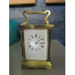 A 20th century French brass five window carriage clock, with key