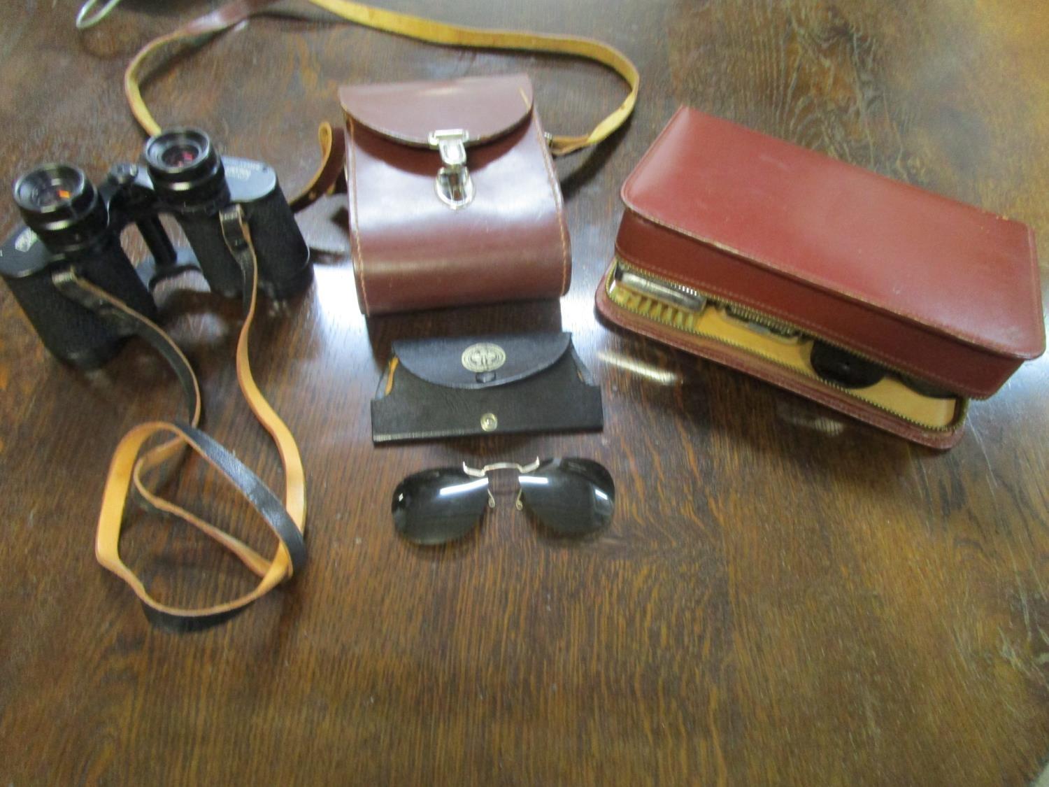 Carl Zeiss Jenoptem leather and cased binoculars 8 x 30w, a cased vanity set and shade for glasses