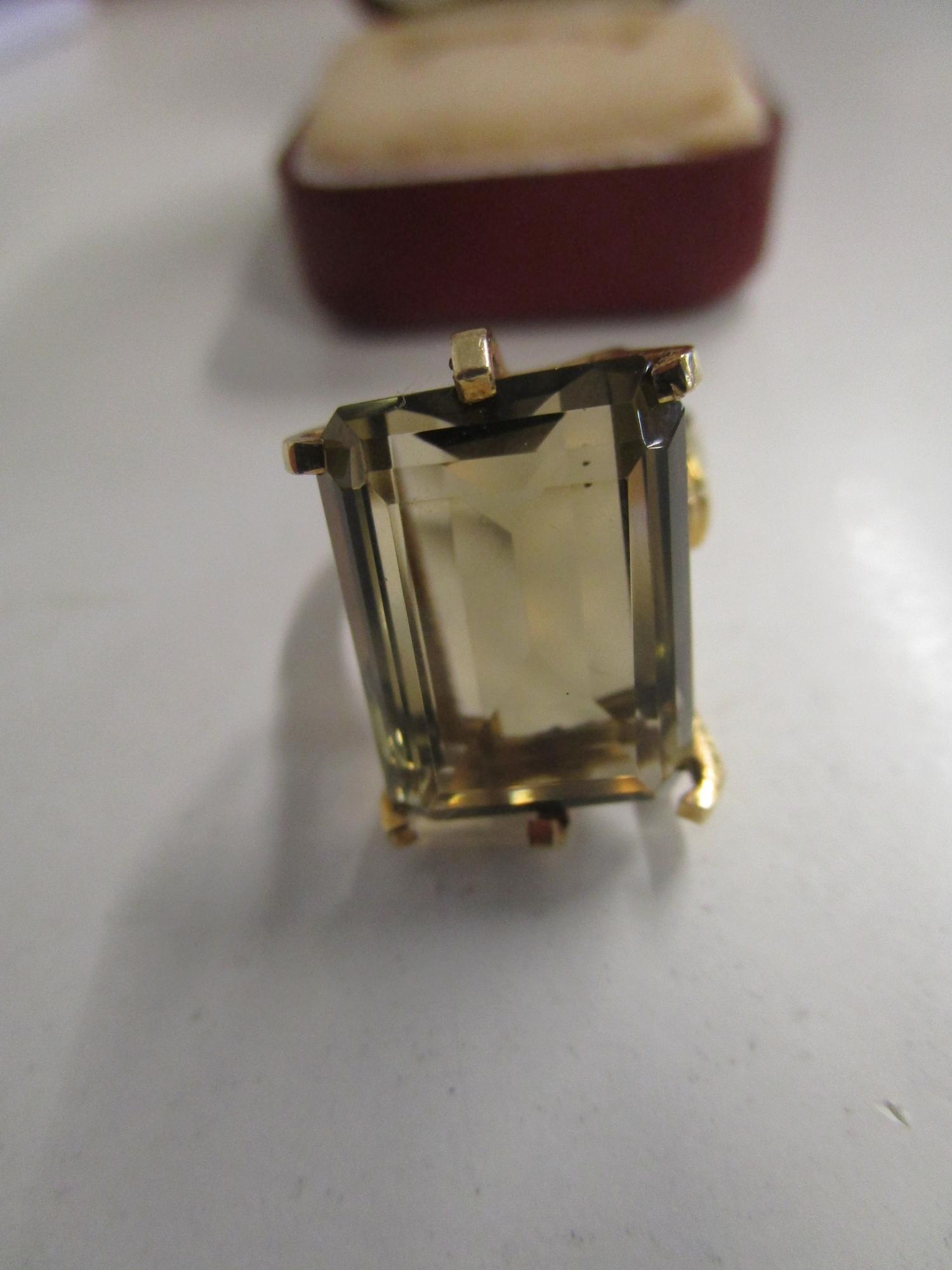 A gold coloured ring set with a large citrine, marks to exterior of shank - Image 2 of 4