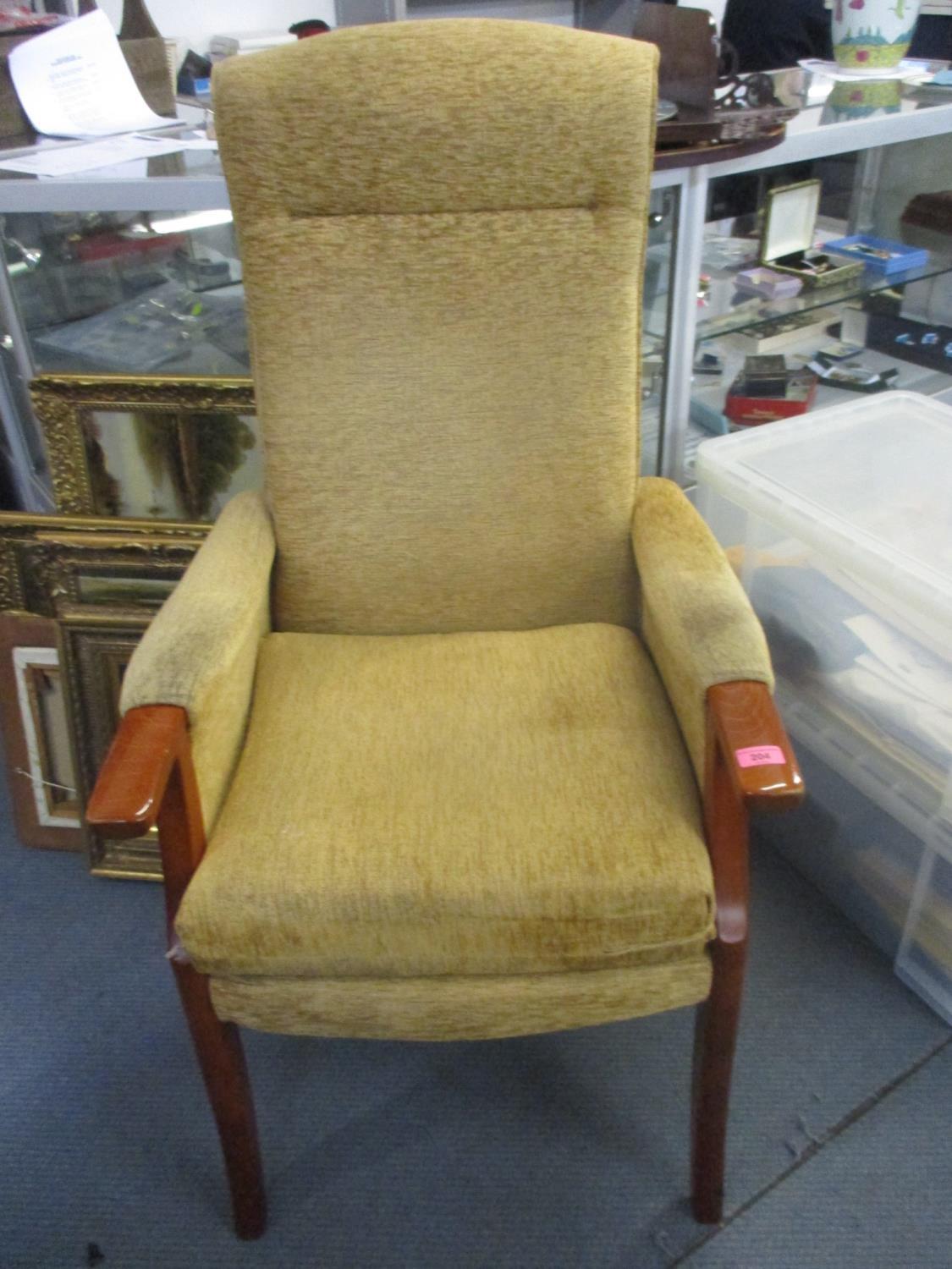 Two upholstered large armchairs, and a modern metal standard lamp