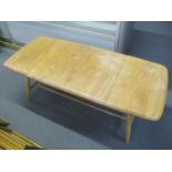 A light Ercol elm coffee table, 14 1/4"h x 41"w