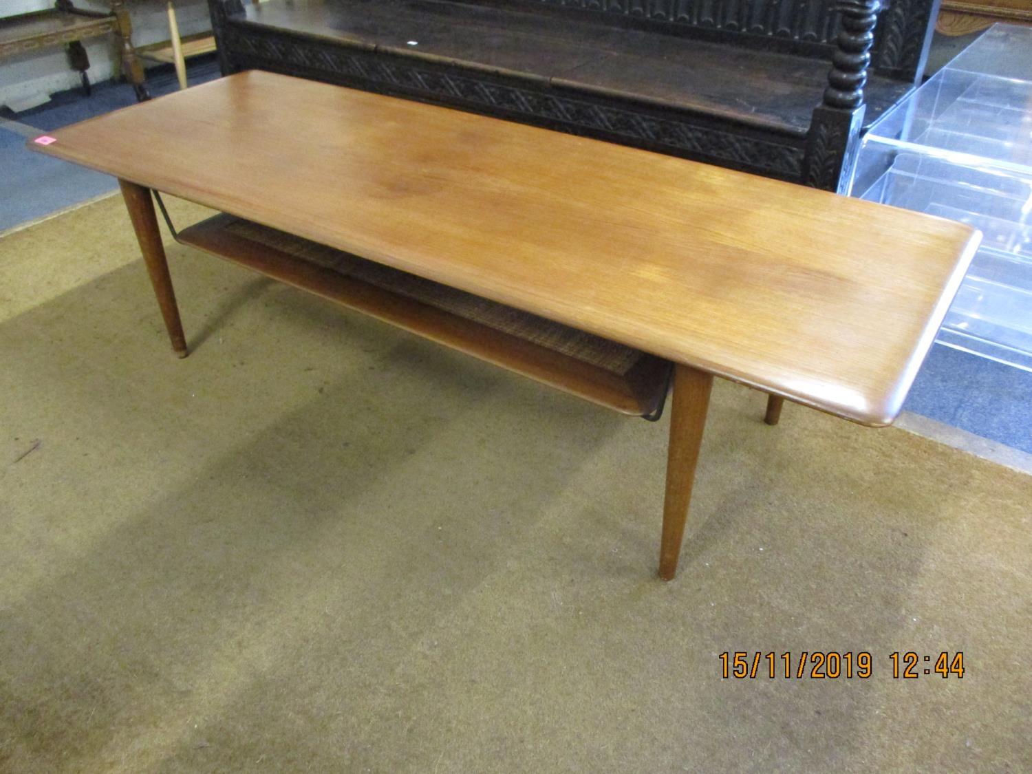A retro teak coffee table with shelf below 16" x 57" x 21"