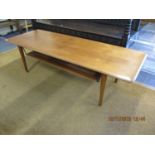 A retro teak coffee table with shelf below 16" x 57" x 21"