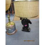 A mid 20th century American green/black glazed table lamp fashioned as a horse, and a printing