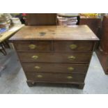 An early 19th century mahogany chest of two short and three long graduated drawers on bracket feet