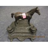 A reproduction bronze horse on a spelter base in the form of an ink well