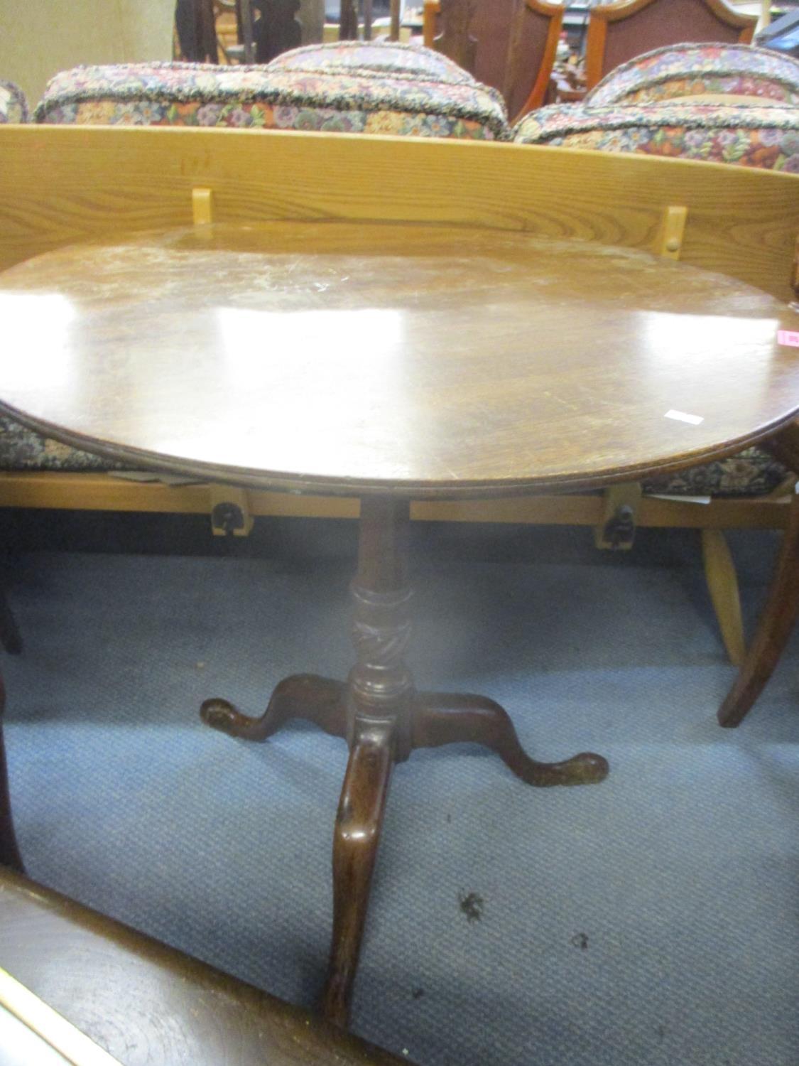 A part Georgian mahogany pedestal occasional table, circular top on turned column and splayed feet