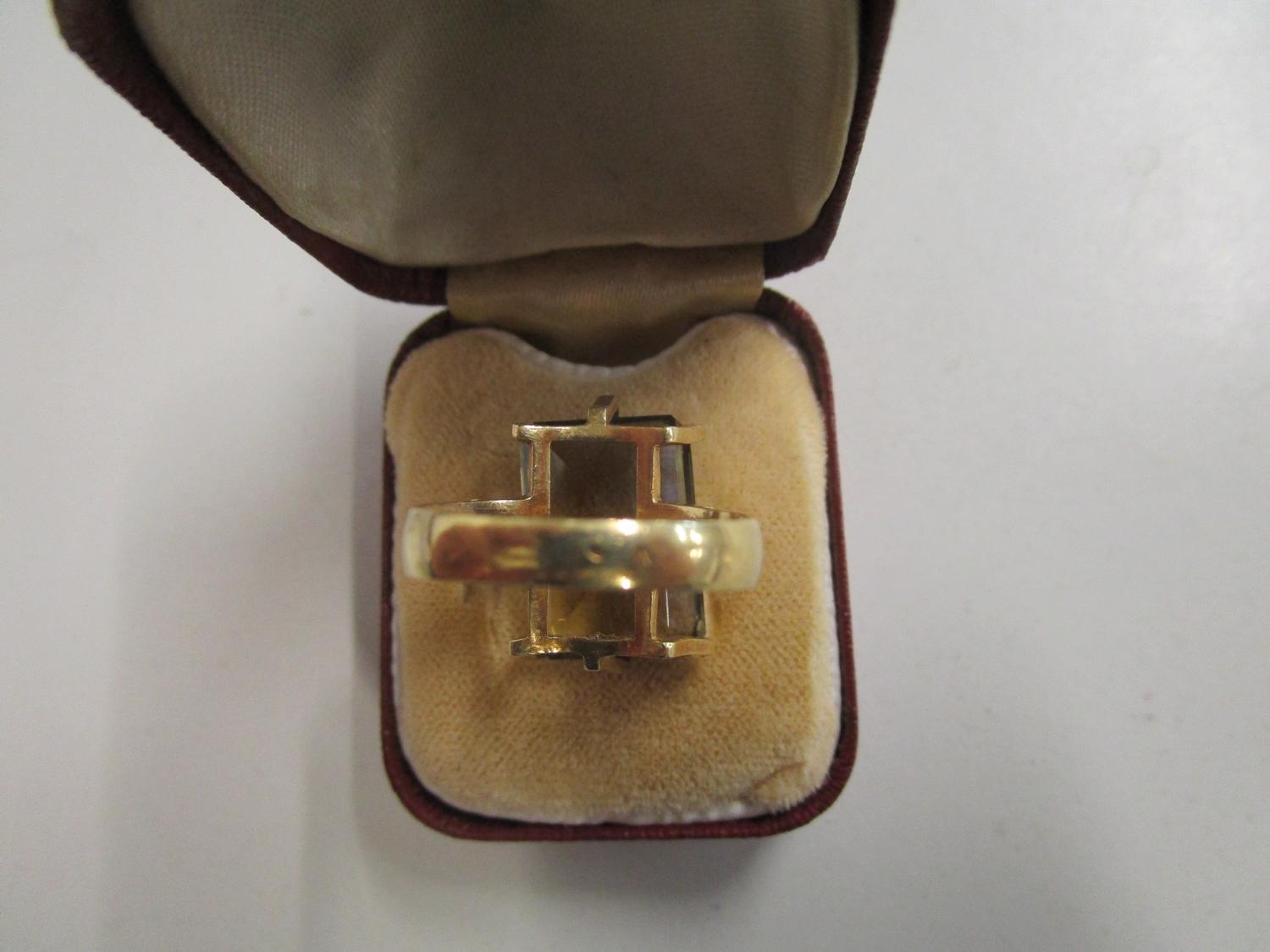 A gold coloured ring set with a large citrine, marks to exterior of shank - Image 4 of 4