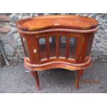 A reproduction mahogany kidney shaped drinks cabinet