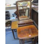 A nesting set of three mahogany occasional tables and a walnut occasional table with metal galleried