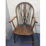 A mid 20th century elm and ash Windsor chair