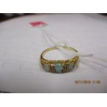 An 18ct gold, opal and diamond ring