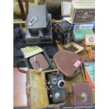 Vintage cameras and accessories to include Rolleicord, a cine Kodak, a box Brownie in original box