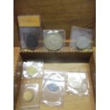 A group of coins and tokens to include a copper Barbados 1788 penny, a 1951 Crown and others in a
