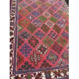 A Middle Eastern pink ground rug, 42x59"