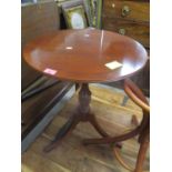 A reproduction yew wood circular topped occasional table on three splayed legs, 24" h x 20"w
