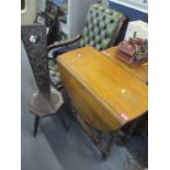 An early 20th century oak gateleg table together with a carved oak sewing chair