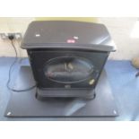 A black electric stove effect heater, 23" h x 22"w
