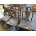 A set of six early 20th century oak dining chairs with drop in seats