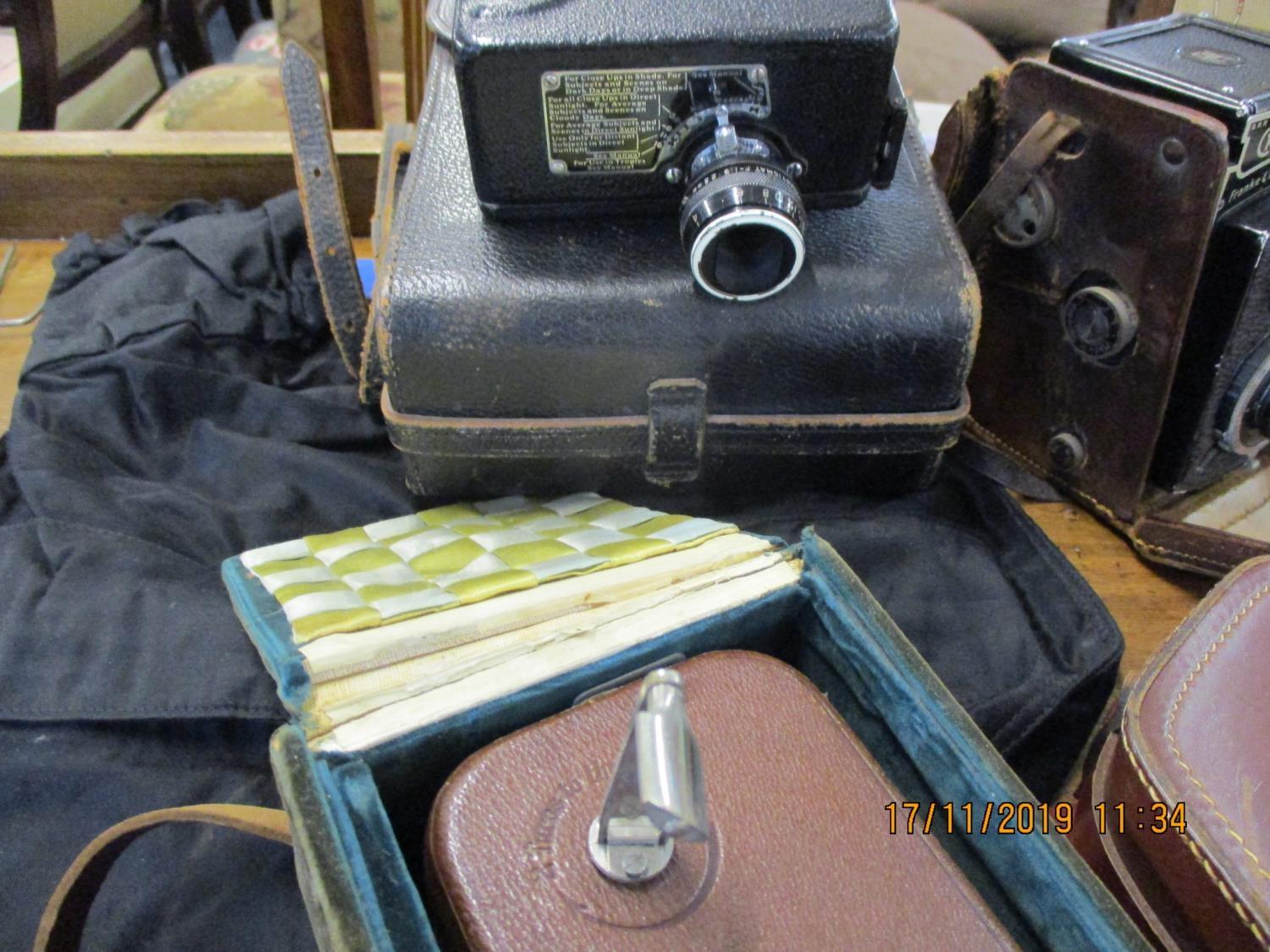 Vintage cameras and accessories to include Rolleicord, a cine Kodak, a box Brownie in original box - Image 3 of 3