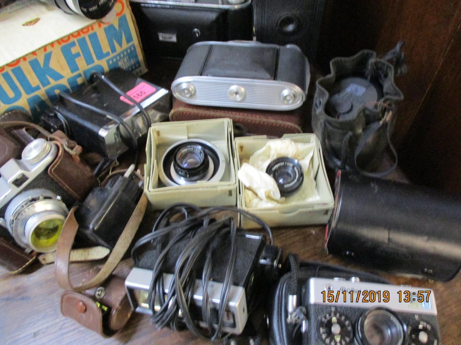 Vintage cameras to include a Nikkormat and an Agfa Isolette with camera accessories and mixed lenses - Image 2 of 2