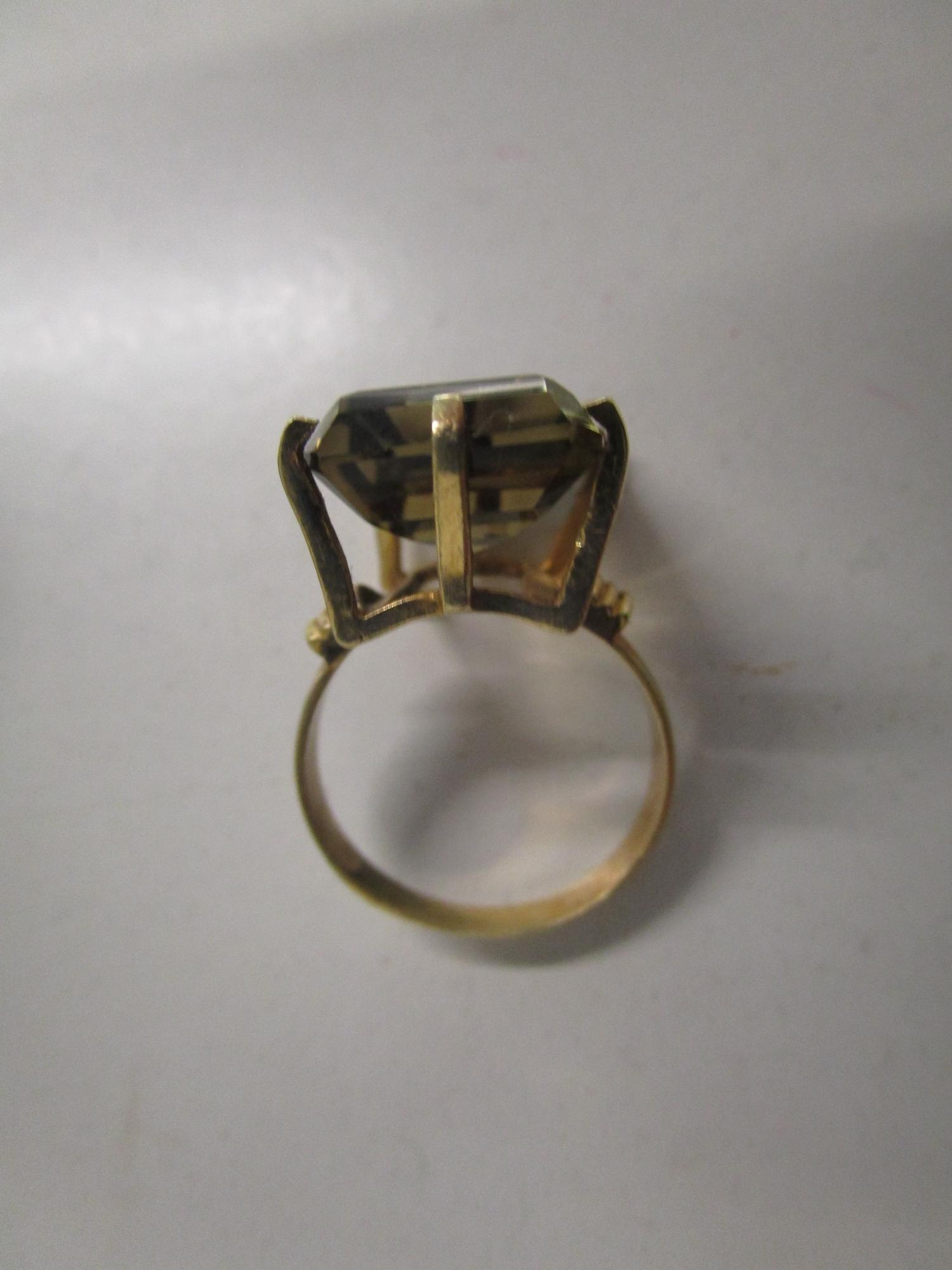 A gold coloured ring set with a large citrine, marks to exterior of shank - Image 3 of 4