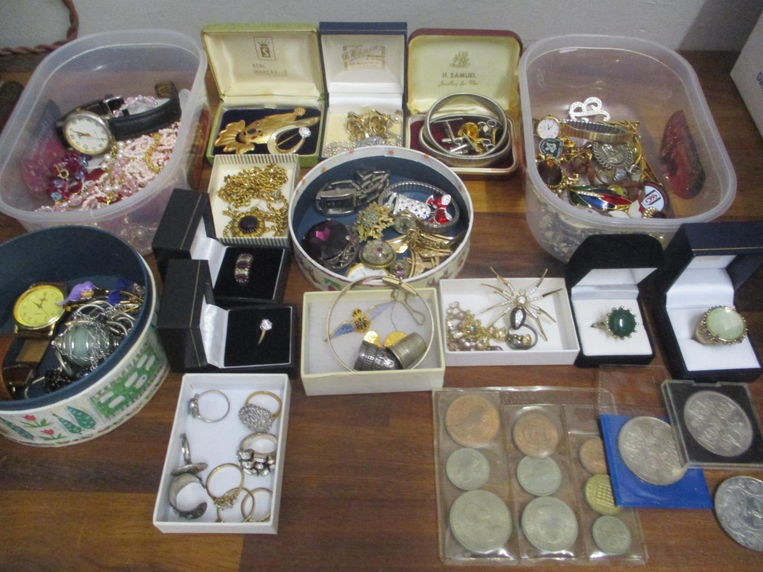 A quantity of costume jewellery to include silver rings, RAF wing brooch, watches and mixed coins