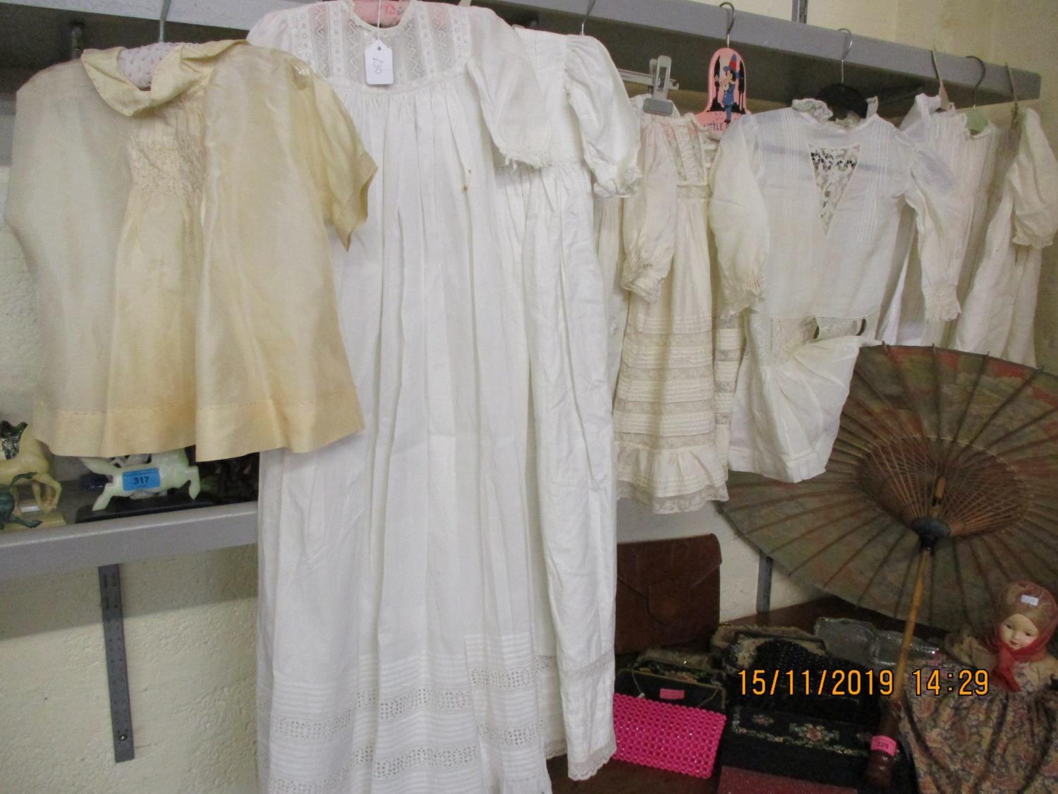 A collection of early 20th century children's clothing and later, to include christening dresses and