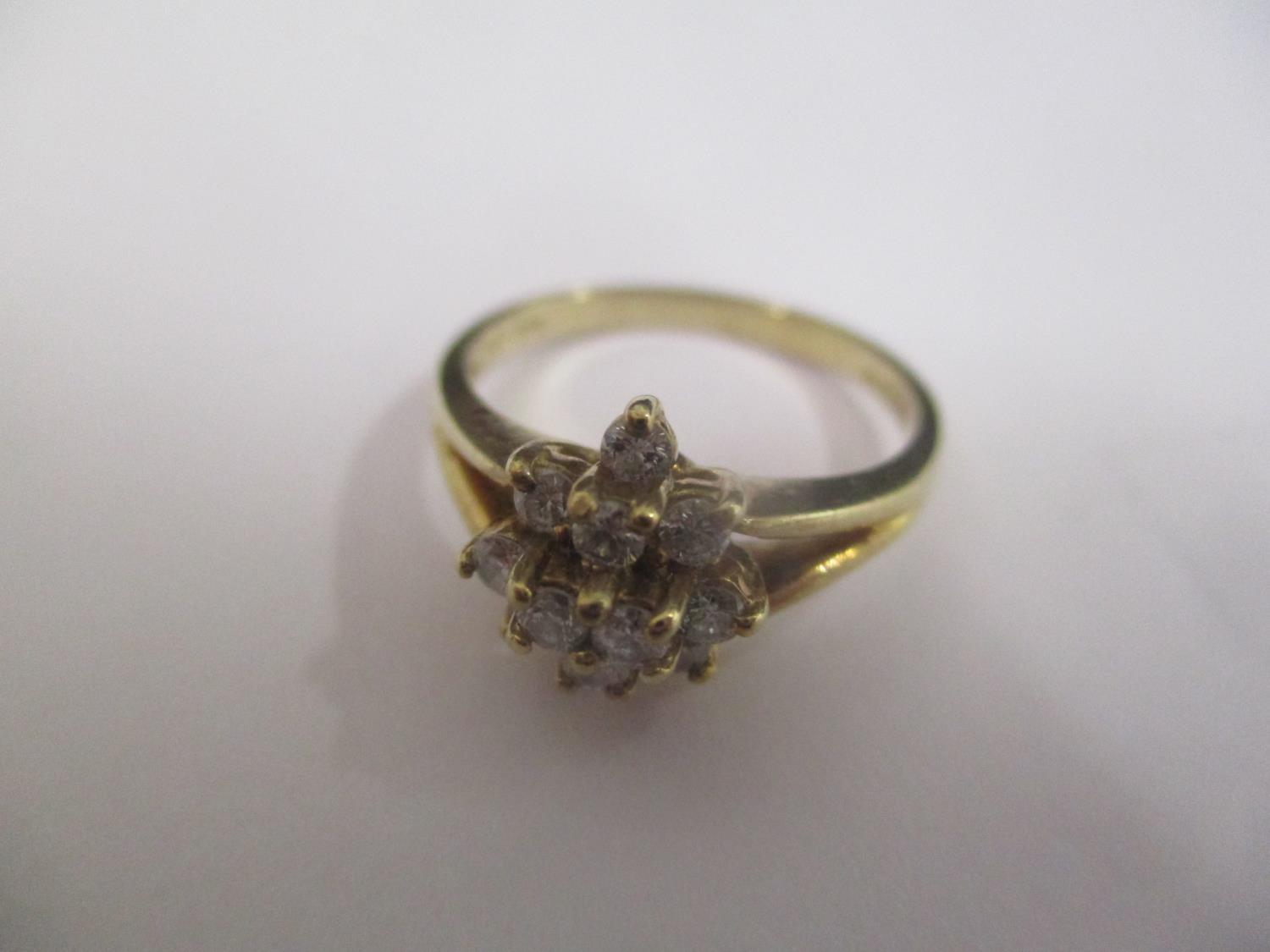 A 9ct gold diamond cluster ring, 2.4g