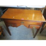 A reproduction Georgian style oak desk having one long and two short drawers, 27 1/2" h x 34"w
