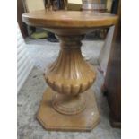 A marble circular topped stand having a fluted column and standing on an octagonal base, 29 3/4" h x