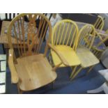 A set of four mid 20th century yellow painted spindle back dining chair and a Windsor carver chair