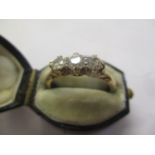 An 18ct gold three stone diamond rings
