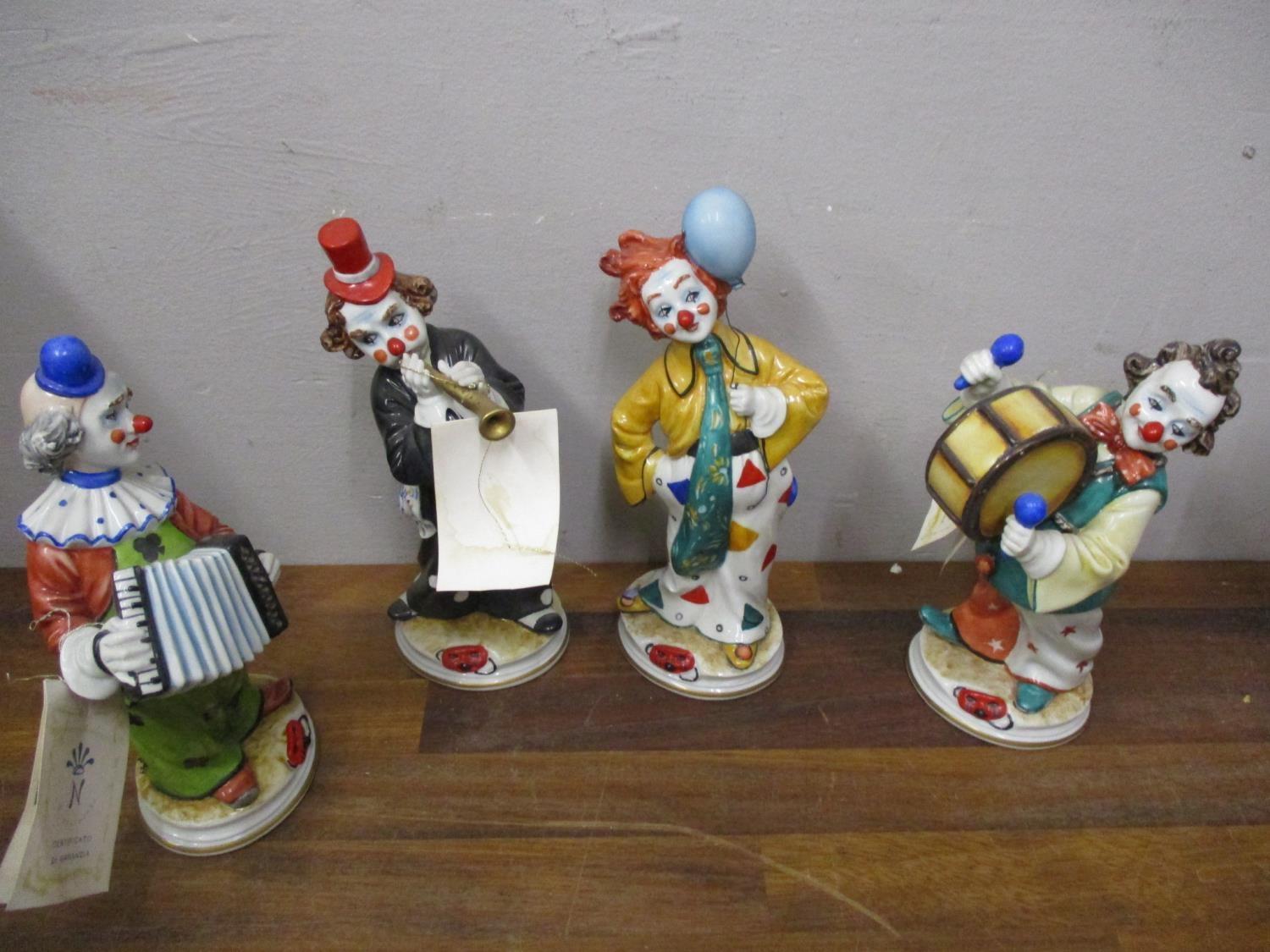 Four Sonia by Courtese Capodimonte figures of clowns