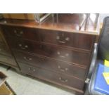 A Georgian mahogany chest of two short and two long drawers having swan neck handles and bracket