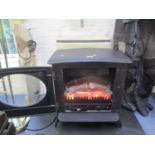 A black electric stove effect heater, 23" h x 22"w