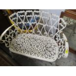 A cast iron white painted two-seater garden bench