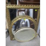 Three mirrors to include two gilt examples and a cream and gilt oval mirror with bow ornament