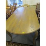 A French stained oak dining table with cabriole legs, 31" x 77" x 40"