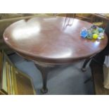 A 1920s mahogany extending dining table having two extra leaves and on cabriole legs, 29" h x 92"