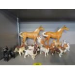 A collection of Beswick and porcelain animals to include various dogs