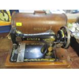 A cased Singer sewing machine