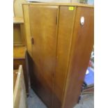 A mid 20th century teak single door wardrobe and a chest of four drawers