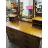 A Victorian satinwood dressing chest with a mirror and four jewellery drawers, above two short and