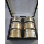 A cased set of six early 20th century cased silver napkin rings