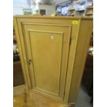 A late 19th century pine corner cabinet with a panelled door 39"h x 30"w